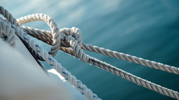 Free photo closeup of the ship wires with the sea