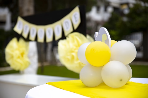 Closeup shot of balloons and an elephant toy