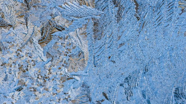 Closeup shot of beautiful frost patterns and textures on a glass