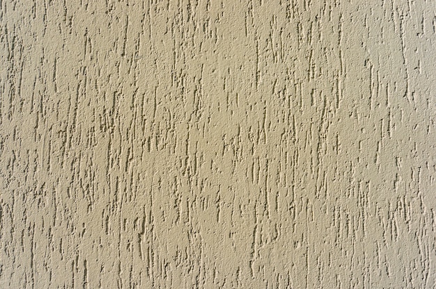 Closeup shot of a beige textured wall