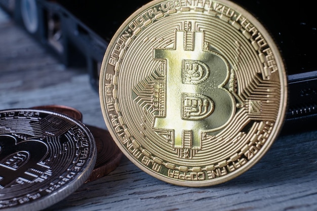 Closeup shot of a bitcoin in a wooden surface