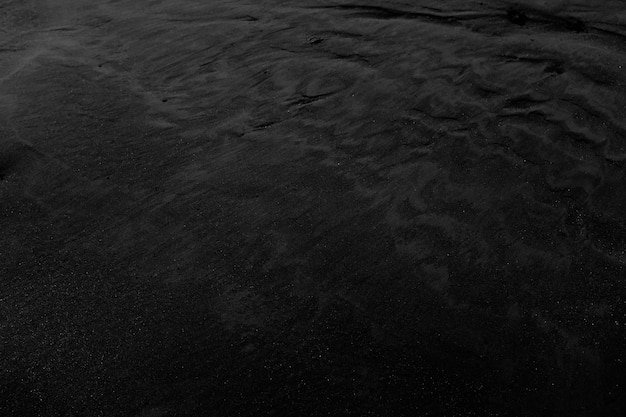 Free photo closeup shot of black wet sand