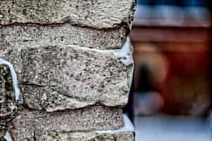 Free photo closeup shot of a brick wall with snow on it