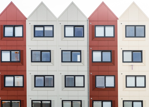 Free Photo closeup shot of a building with red and white sections and triangular roofs