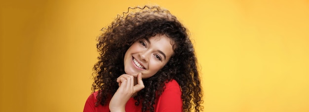 Free photo closeup shot of charming flirty and silly curlyhaired young woman making faces as trying get what wa