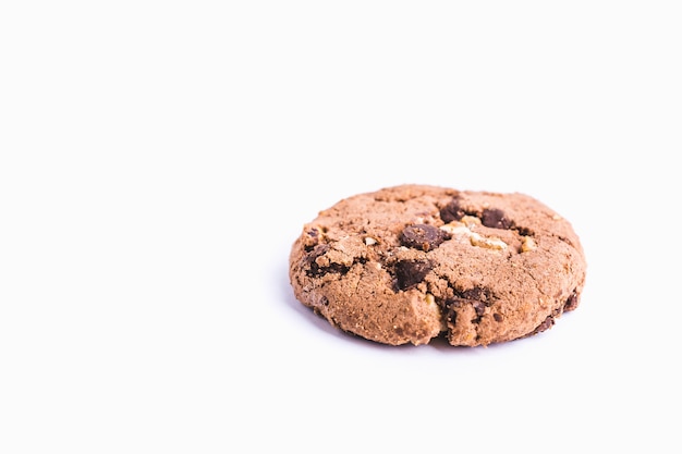 Closeup shot of a chocolate chip cookie isolated on a white background