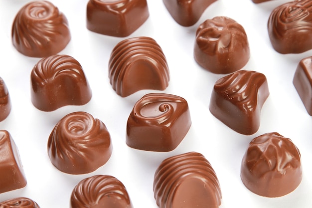 Closeup shot of chocolate pralines isolated on a white wall