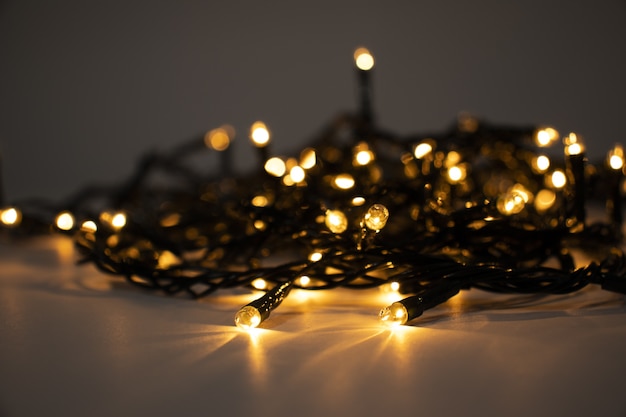 Free Photo closeup shot of christmas lights on a white surface