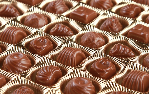 Free photo closeup shot of decorative chocolates in a container