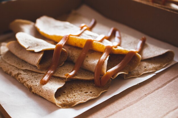 Closeup shot of delicious crepes covered with caramel