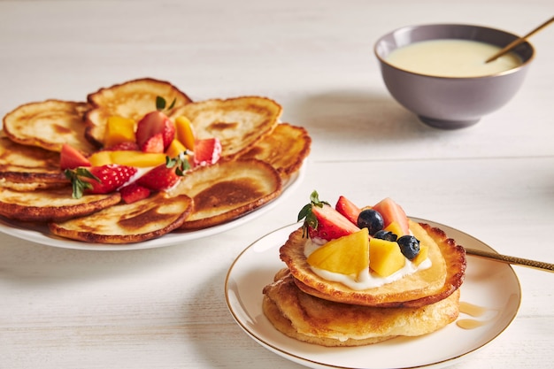 Closeup shot of delicious pancakes with fruits on the top