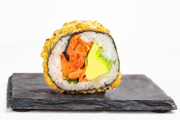 Closeup shot of delicious sushi roll on white surface