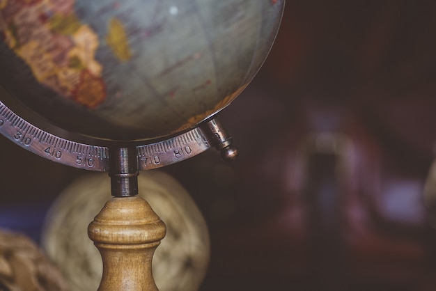 Free photo closeup shot of a desk globe with a blurred background