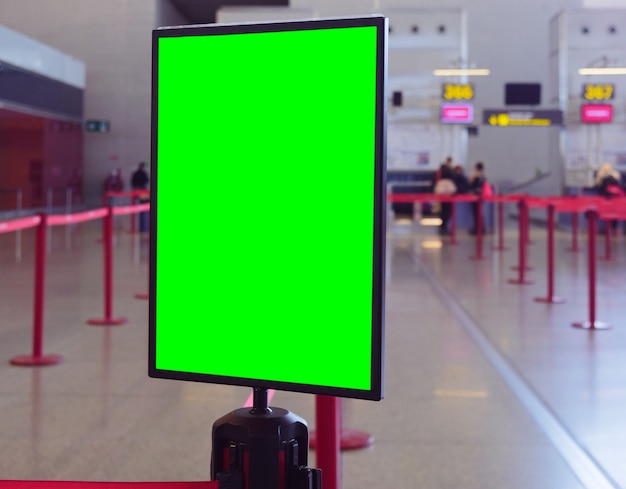 Free photo closeup shot of a display board with a green space for your image in a commercial building