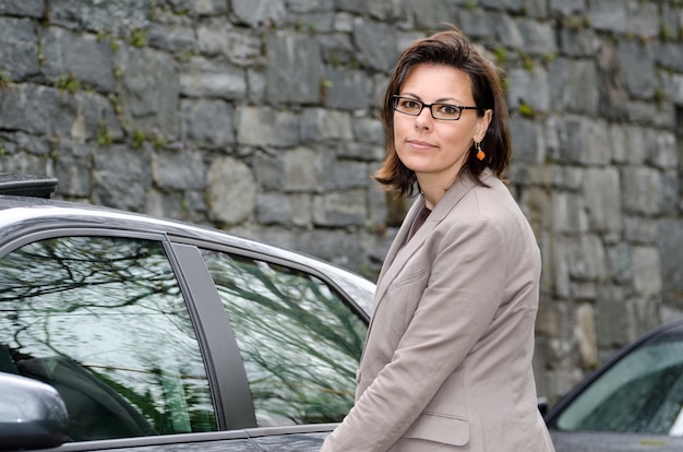 Closeup shot of elegant female with her car