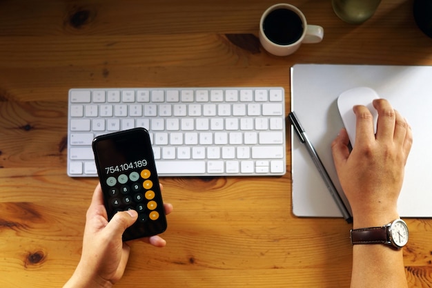 Closeup shot of an entrepreneur working from home and doing calculations