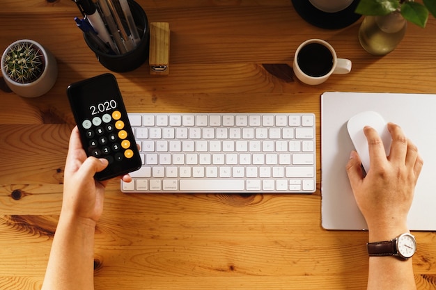 Free photo closeup shot of an entrepreneur working from home and doing calculations