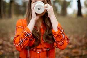 Free photo closeup shot of a female drinking coffee