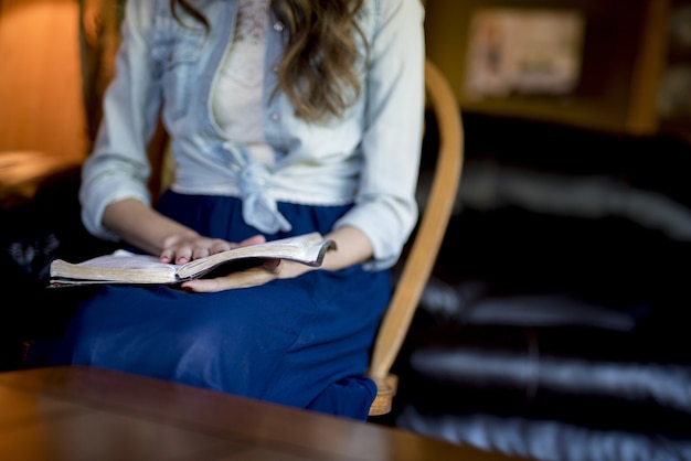 Free Photo closeup shot of a female reading the bible