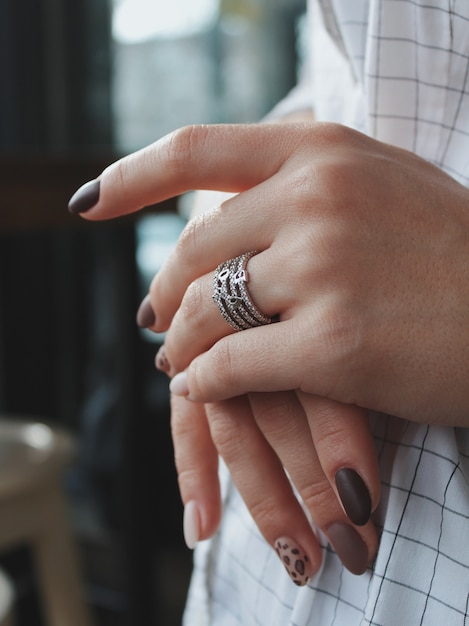 Free photo closeup shot of a female wearing a beautiful silver ring