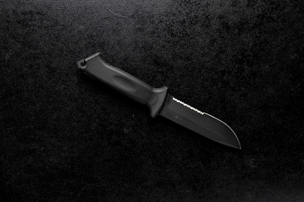 Free Photo closeup shot of a fixed sharp knife on a black