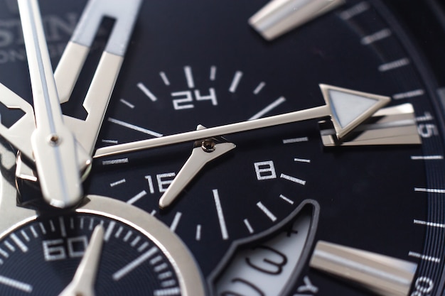 Free Photo closeup shot of the hands, numbers and hour marks of a black watch