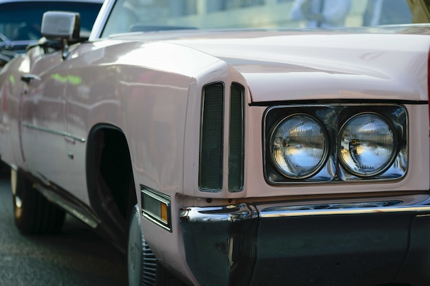 Free photo closeup shot of the headlights of a beige antique car