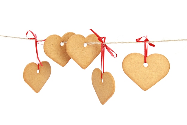 Free Photo closeup shot of heart-shaped cookies isolated on a white background