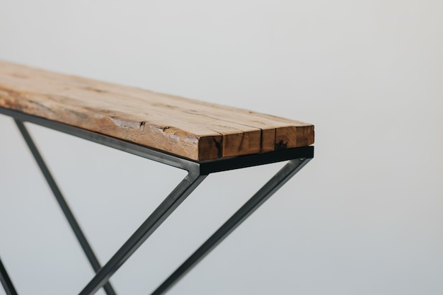 Closeup shot of an ironing board made of a wooden surface