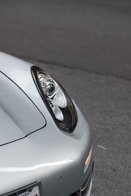 Free Photo closeup shot of the left headlight of white sports car