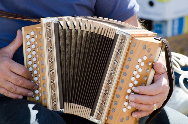 Free photo closeup shot of a male playing the accordion