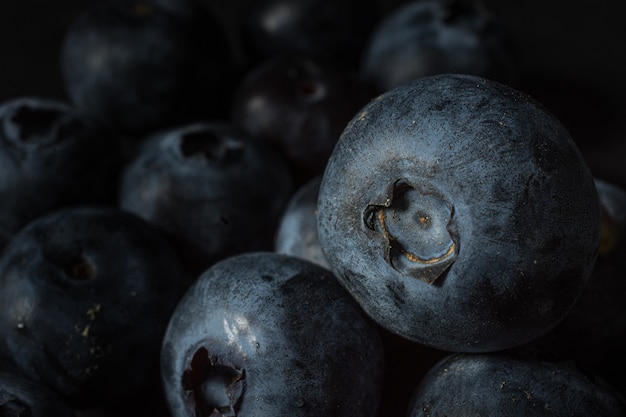 Closeup shot of many blueberries one on another