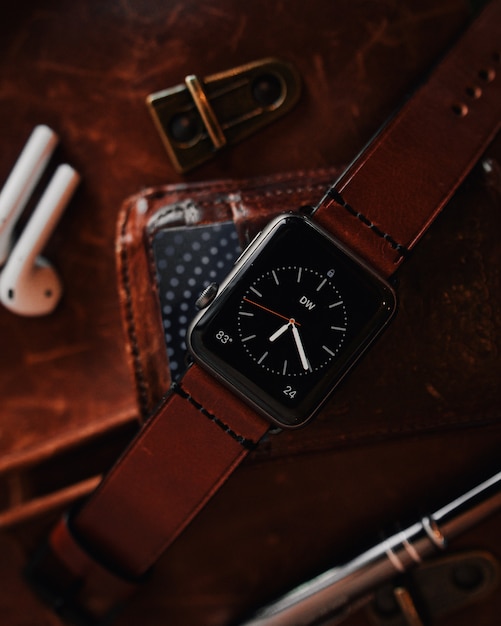 Closeup shot of a modern cool black digital watch with a brown leather strap