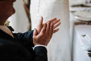 Free photo closeup shot of an old male hands clapping