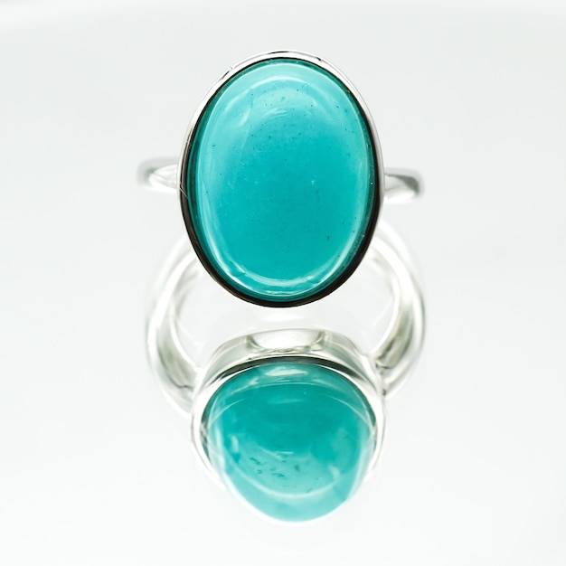 Free Photo closeup shot of an oval-shaped amazonite ring on a white surface