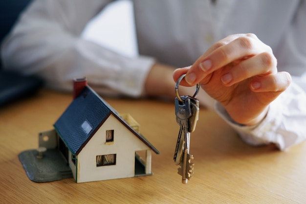 Free photo closeup shot of a person thinking of buying or selling a house