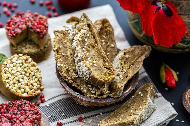 Free Photo closeup shot of raw vegan bread with poppies on a dark tabletop