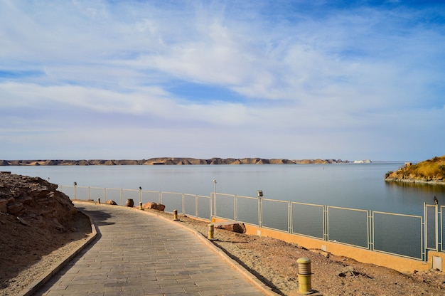 Closeup shot of a road near the sea on a sunny day