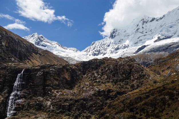 Closeup shot of rocky mountain peaks with parts in snow