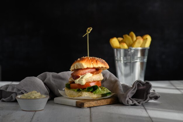 Closeup shot of a sandwich and french fries on the table