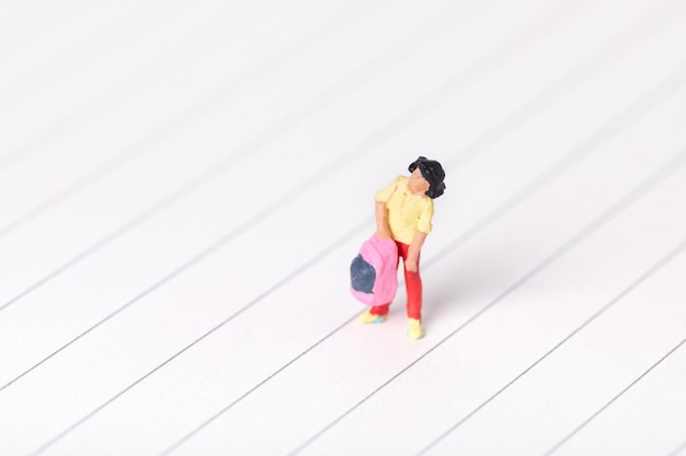 Free Photo closeup shot of a student figurine carrying her backpack