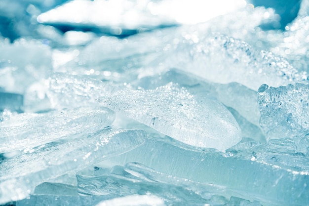 Closeup shot of a transparent shining clear ice sparkling on a frozen wild lakeshore