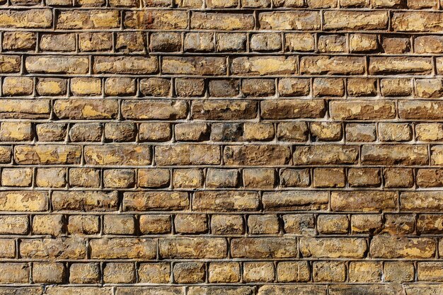 Closeup shot of a wall made of rectangular stones texture background