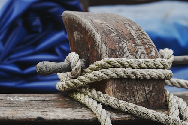 Free Photo closeup shot of a white rope tied on wood