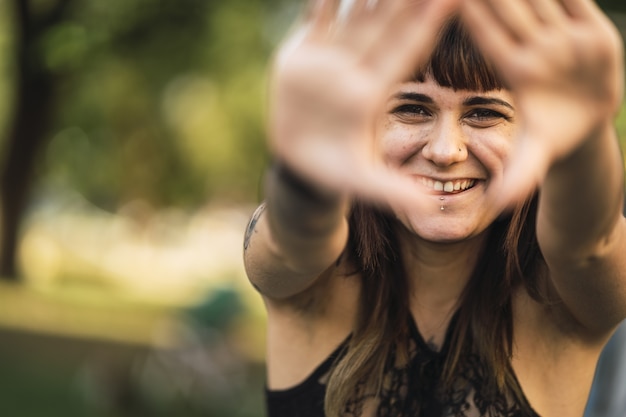 Free photo closeup shot of a young attractive caucasian female with tattoos making a cute face