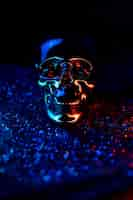 Free photo closeup of a skull illuminated with colorful neon lights