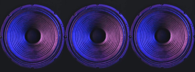 Free photo closeup of speakers membrane on black background with colored lighting