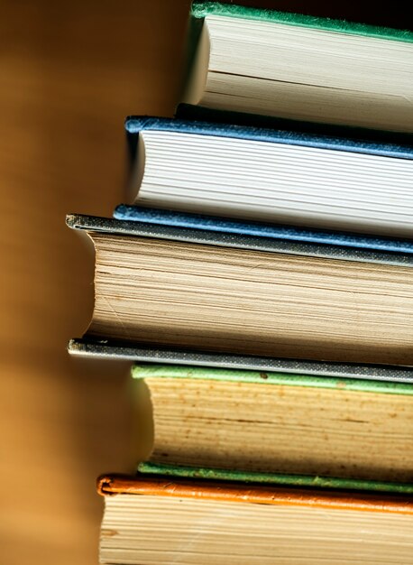 Free Photo closeup of stack of antique books educational, academic and literary concept