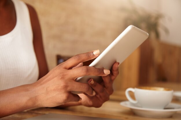 Closeup of tablet in woman's hands