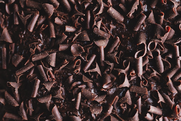 Free Photo closeup of tasty chocolate cake with chocolate chunks on baking sheet. closeup.